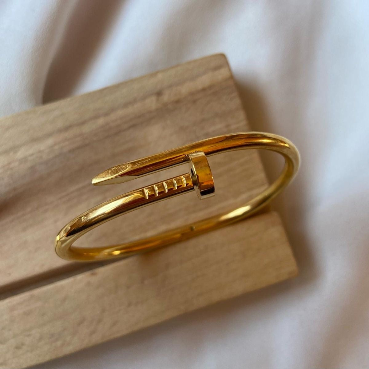 Gold nail bracelet